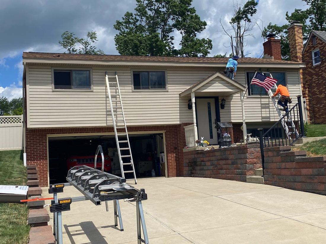 Pro Home and Roofing crew installing a roof