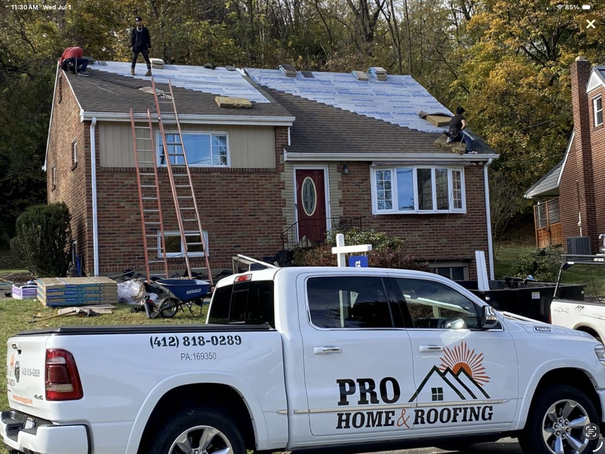 Pro Home and Roofing crew installing CertainTeed underlayment on a Pittsburgh home